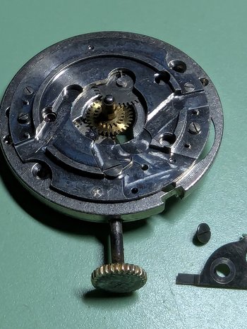 The date setting lever removed (the pusher on the side of the case presses this, which advances the date) 